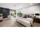 Spacious main bedroom featuring a modern fireplace, sitting area, and access to the backyard at 2861 Queens Courtyard Dr, Las Vegas, NV 89109