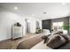 Bright main bedroom with a fireplace, sitting area and stylish accents offers a cozy retreat at 2861 Queens Courtyard Dr, Las Vegas, NV 89109