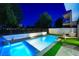 Backyard pool at twilight with lush landscaping, patio area, and lounge chairs at 2861 Queens Courtyard Dr, Las Vegas, NV 89109