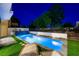 Backyard pool with water feature and lush landscaping offers a private outdoor retreat at 2861 Queens Courtyard Dr, Las Vegas, NV 89109