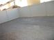 Large backyard with a white fence and gravel at 3104 Naggio Shores Ave, Las Vegas, NV 89141