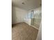 An open bathroom design that has a shower, tub, and tile flooring at 3104 Naggio Shores Ave, Las Vegas, NV 89141
