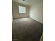 A bedroom with carpeting and one window at 3104 Naggio Shores Ave, Las Vegas, NV 89141