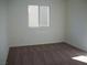 Bedroom with neutral carpeting and a large window at 3104 Naggio Shores Ave, Las Vegas, NV 89141
