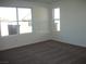 Bright and airy bedroom with large windows and neutral carpet at 3104 Naggio Shores Ave, Las Vegas, NV 89141