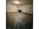 Two car garage with overhead lighting, and concrete flooring at 3104 Naggio Shores Ave, Las Vegas, NV 89141