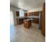 Kitchen with a center island, tile floors, and stainless steel appliances at 3104 Naggio Shores Ave, Las Vegas, NV 89141