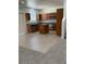 Kitchen with a center island, tile floors, stainless appliances, and carpeted area at 3104 Naggio Shores Ave, Las Vegas, NV 89141