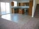 Open concept kitchen with stainless steel appliances and a kitchen island at 3104 Naggio Shores Ave, Las Vegas, NV 89141
