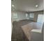 A spacious living room with new carpet and tile flooring at 3104 Naggio Shores Ave, Las Vegas, NV 89141