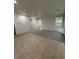 Spacious living room with neutral carpet and tile floors at 3104 Naggio Shores Ave, Las Vegas, NV 89141