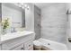 A modern bathroom featuring elegant tiling and a spacious shower stall at 3151 Soaring Gulls Dr # 1049, Las Vegas, NV 89128