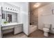 Well-lit bathroom featuring a vanity, a tub and a toilet at 3151 Soaring Gulls Dr # 1049, Las Vegas, NV 89128