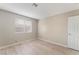 Bedroom with wood floors, large window for natural light, and a door to the hall at 3151 Soaring Gulls Dr # 1049, Las Vegas, NV 89128