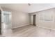Bright bedroom with wood floors, and an adjacent bathroom and walk-in closet at 3151 Soaring Gulls Dr # 1049, Las Vegas, NV 89128