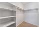 Walk-in closet featuring built-in shelving and tile flooring at 3151 Soaring Gulls Dr # 1049, Las Vegas, NV 89128