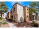 Attractive condo building with red rock landscaping, and stairs at 3151 Soaring Gulls Dr # 1049, Las Vegas, NV 89128