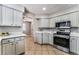Spacious kitchen area featuring updated stainless steel appliances, light countertops and ample cabinet storage at 3151 Soaring Gulls Dr # 1049, Las Vegas, NV 89128