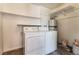 Functional laundry room with washer, dryer, and ample shelving for storage at 3151 Soaring Gulls Dr # 1049, Las Vegas, NV 89128
