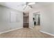 Inviting living room with tile floors and ceiling fan, leading to the kitchen at 3151 Soaring Gulls Dr # 1049, Las Vegas, NV 89128