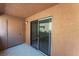 Private outdoor patio with a sliding glass door at 3151 Soaring Gulls Dr # 1049, Las Vegas, NV 89128