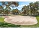 Community recreation area featuring a sand volleyball court and basketball court surrounded by mature trees and manicured lawns at 3151 Soaring Gulls Dr # 1049, Las Vegas, NV 89128