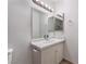 Bathroom vanity with an oversized mirror and modern lighting at 3151 Soaring Gulls Dr # 2113, Las Vegas, NV 89128