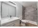Bathroom features a tiled walk-in shower with new fixtures and a bright vanity with a mirrored wall cabinet at 3151 Soaring Gulls Dr # 2113, Las Vegas, NV 89128