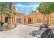 Well-maintained clubhouse entrance with desert landscaping and ample parking at 3151 Soaring Gulls Dr # 2113, Las Vegas, NV 89128
