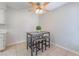 Eat-in kitchen features a modern gray table with seating under a ceiling fan at 3151 Soaring Gulls Dr # 2113, Las Vegas, NV 89128