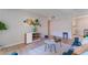 Bright living space with stylish decor, furniture, tiled floors, and view into the dining area and kitchen at 3151 Soaring Gulls Dr # 2113, Las Vegas, NV 89128