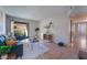 Cozy living room features a blue sofa set and sliding door to a patio, offering a blend of comfort and style at 3151 Soaring Gulls Dr # 2113, Las Vegas, NV 89128
