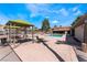 Outdoor community pool area featuring lounge chairs, seating, and well-maintained landscaping at 3151 Soaring Gulls Dr # 2113, Las Vegas, NV 89128