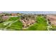 Aerial view overlooking the golf course, buildings, and desert landscape at 405 Paradise Pkwy # 170, Mesquite, NV 89027