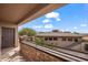 Private balcony with chairs, views of the lush landscaping and the building's architecture at 405 Paradise Pkwy # 170, Mesquite, NV 89027