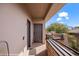 Exterior doors on the balcony and the stone accents blend with the lush green landscape in the background at 405 Paradise Pkwy # 170, Mesquite, NV 89027