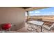 Balcony with outdoor grill and table overlooking desert landscape with a golf course at 405 Paradise Pkwy # 170, Mesquite, NV 89027