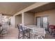 Spacious covered balcony featuring neutral toned siding, furniture, and outdoor grill at 405 Paradise Pkwy # 170, Mesquite, NV 89027
