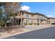 Multi-Gathering building with neutral color scheme, stone accents, covered parking, and landscaped grounds at 405 Paradise Pkwy # 170, Mesquite, NV 89027
