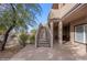 Exterior stairs lead to the building's second-floor condos, with covered seating area on the ground floor at 405 Paradise Pkwy # 170, Mesquite, NV 89027