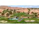 Picturesque golf course features a serene lake, a bridge, and a perfectly manicured green at 405 Paradise Pkwy # 170, Mesquite, NV 89027