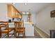 Functional kitchen with bar seating, wood cabinets, and modern appliances at 405 Paradise Pkwy # 170, Mesquite, NV 89027