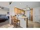 Bright kitchen features tile floor, granite countertops, wooden cabinets, and stainless-steel appliances at 405 Paradise Pkwy # 170, Mesquite, NV 89027