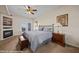 Cozy main bedroom showcasing ceiling fan, carpeting, and decorative fireplace at 405 Paradise Pkwy # 170, Mesquite, NV 89027
