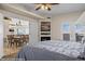 Comfortable bedroom with fireplace, TV, ceiling fan, and doors to an outdoor balcony at 405 Paradise Pkwy # 170, Mesquite, NV 89027