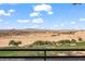 Balcony view of rolling hills and an expansive desert landscape with a golf course in the foreground at 405 Paradise Pkwy # 170, Mesquite, NV 89027