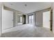 Large bright bedroom featuring carpet, sliding glass doors to the balcony, and a closet at 5199 Caliente St # 63, Las Vegas, NV 89119