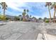 The community's gated entrance with a guardhouse, palm trees, and landscaping, providing a secure and attractive entry point at 5199 Caliente St # 63, Las Vegas, NV 89119