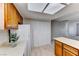 Kitchen features tiled floors and a pantry with white shuttered doors at 5199 Caliente St # 63, Las Vegas, NV 89119