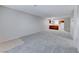Open-concept living room seamlessly connects to the kitchen, featuring neutral walls and plush carpet flooring at 5199 Caliente St # 63, Las Vegas, NV 89119